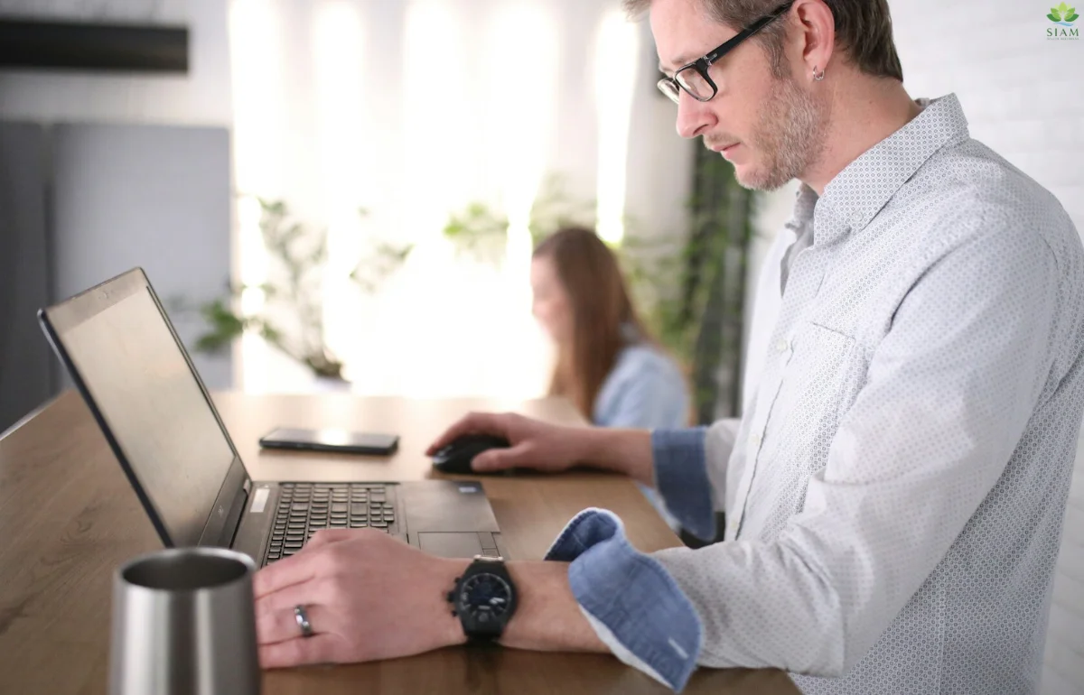 Ergonomic Standing Desk made from walnut wood in a modern home office, featuring a sleek design and smooth electric lift for a productive workspace.