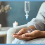IV Vitamin Hydration therapy in a peaceful wellness setting, with an individual receiving treatment.